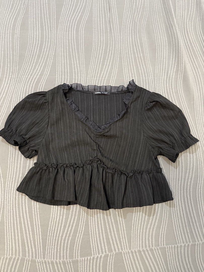 LOVITO Ruffled V-Neck Top (Category: Blouses) located in Arayat. Submitted by decluk8 (Listing ID 1447881319, Image 1). Description: - Dark grey ribbed fabric - Flattering ruffled V-neckline - Chic peplum hem - Cute short puff sleeves - Perfect for dressing up or down with high-waisted bottoms.