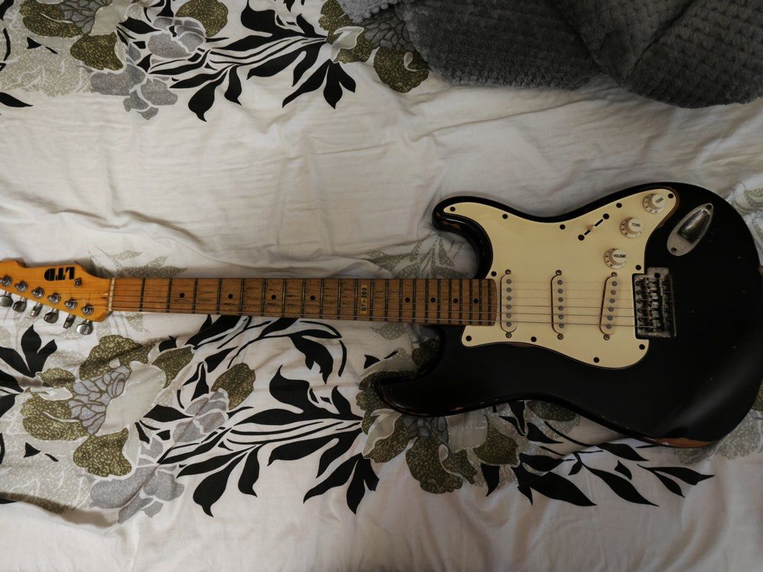 LTD ST-203 electric guitar (Category: Musical Instruments) located in Manila. Submitted by reian0323 (Listing ID 1447734370, Image 1). Description: - ESP LTD Electric Guitar ST-203 Black with white pickguard, relic design - Strat-style body with 3 single-coil pickups (replaced with Wilkinsons) - Maple neck with rosewood fretboard Quick spec details: https://reverb.com/p/esp-ltd-st-203.