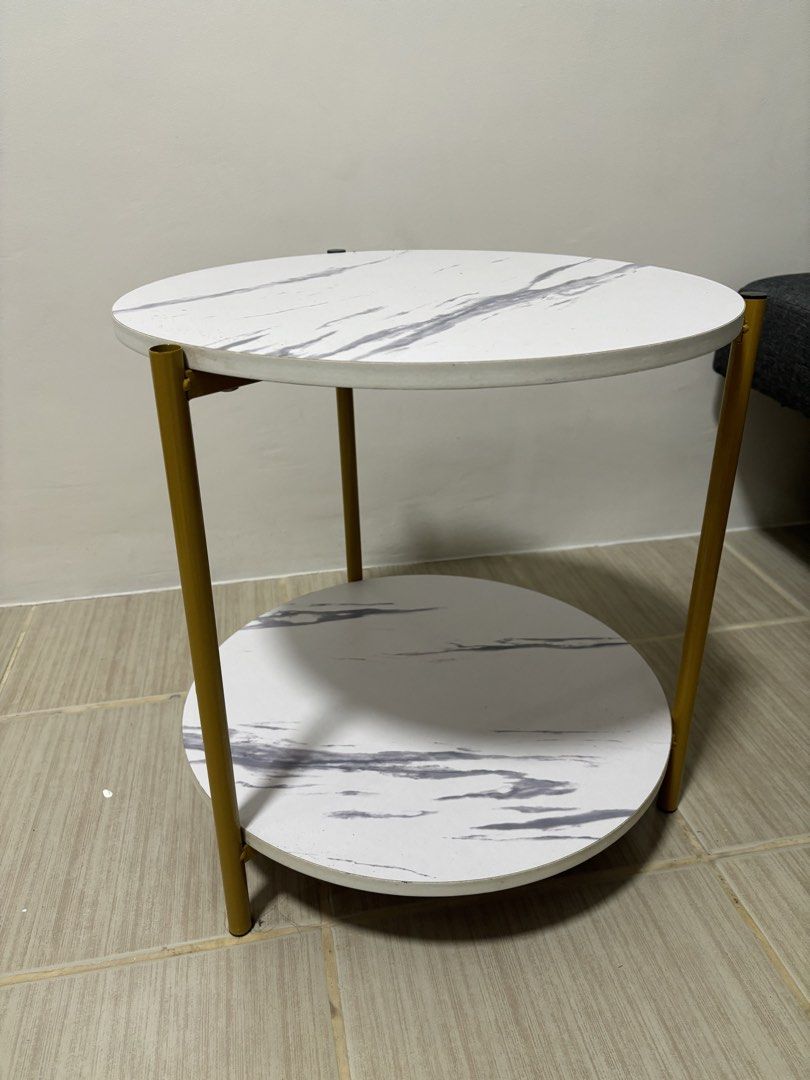 Marble Effect Round 2-Tier Side Table with Gold Legs (Category: Tables & Sets) located in Manila. Submitted by thingsforsale07 (Listing ID 1447715596, Image 3). Description: - Two-tier round side table - White top with elegant grey marble effect - Chic gold metal legs - Ideal for living room or bedroom - Compact design, fits any space - Simple assembly required.