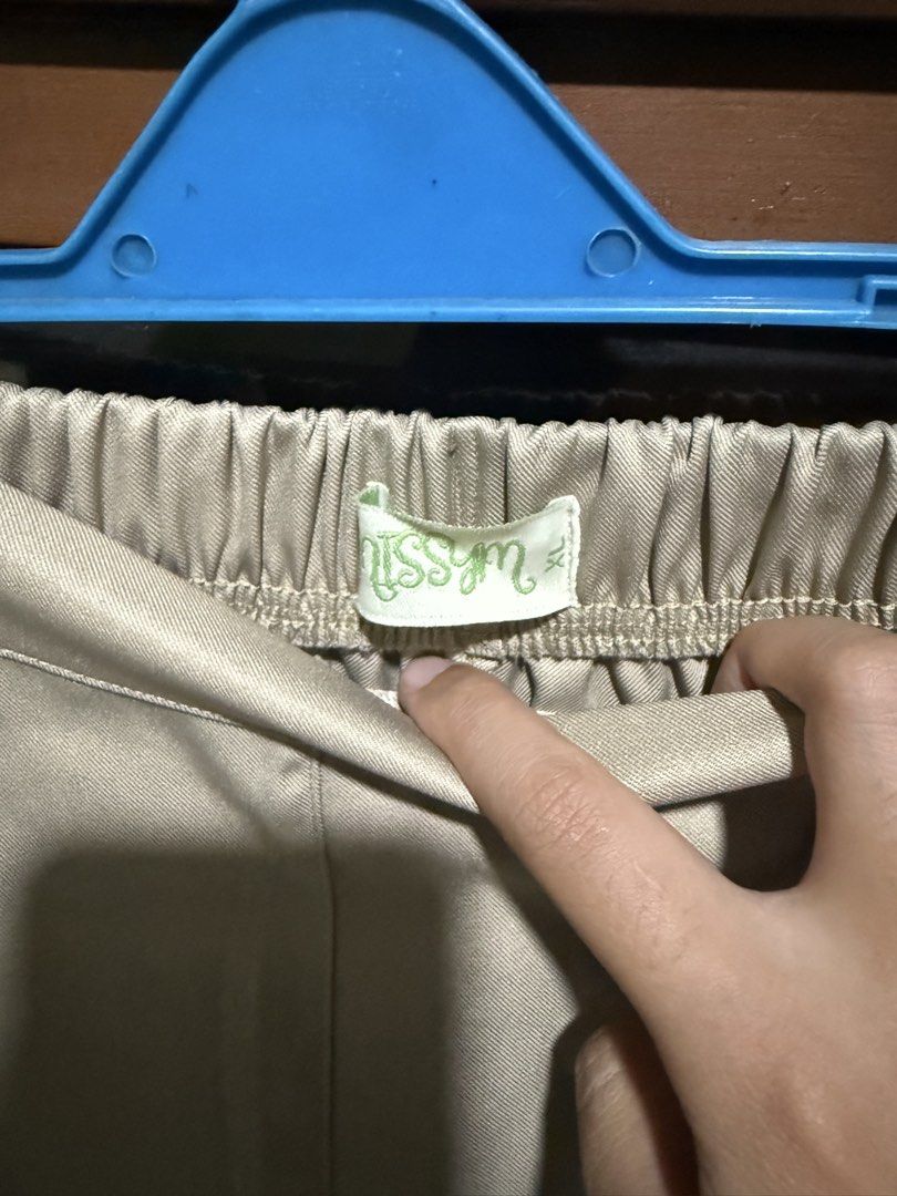 Missym Olive Office Pants (XL) (Category: Other Bottoms) located in Quezon City. Submitted by halpharagus (Listing ID 1447824539, Image 2). Description: - Beige wide-leg pants from Missym - Comfortable elastic waistband - Chic satin-like material - Versatile for casual or dressed-up looks - Easy to style with various tops - Never used but washed - XL on tag.
