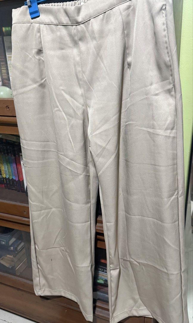 Missym Olive Office Pants (XL) (Category: Other Bottoms) located in Quezon City. Submitted by halpharagus (Listing ID 1447824539, Image 1). Description: - Beige wide-leg pants from Missym - Comfortable elastic waistband - Chic satin-like material - Versatile for casual or dressed-up looks - Easy to style with various tops - Never used but washed - XL on tag.