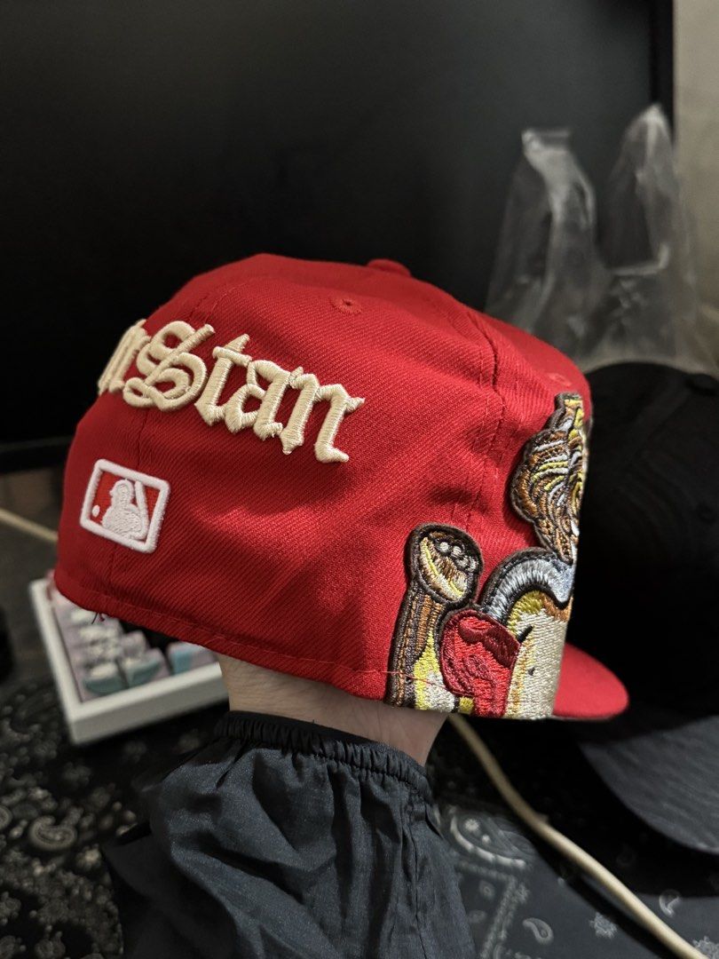 mlb jon stan x new era closed cap (Category: Caps & Hats) located in Valenzuela. Submitted by deztinyy (Listing ID 1447851862, Image 3). Description: - Brand: New Era - Model: 59FIFTY Fitted Hat - Color: Red - Size: 7 - Front: Embroidered 'S' logo - Side Panels: Detailed cherub patches - Back: Embroidered 'Jon Stan' text and MLB logo -.