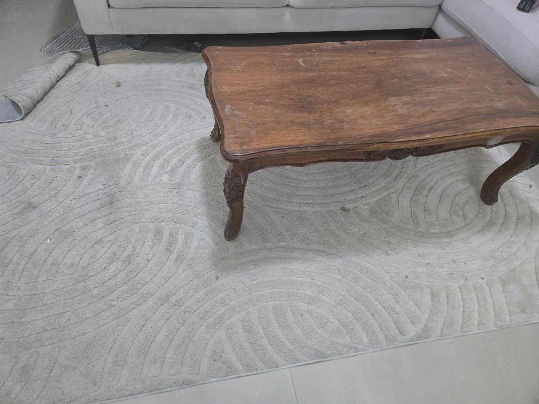 Narra coffee table with ornate legs (Category: Tables & Sets) located in Manila. Submitted by ezehzzyboy (Listing ID 1447835884, Image 2). Description: - Beautiful wooden coffee table with a warm brown tone. - Features elegant curved edges and ornate carved legs. - Perfect size for your living room. - Shows minor surface wear, adding to its character. - Ready to be the centerpiece of your space!.