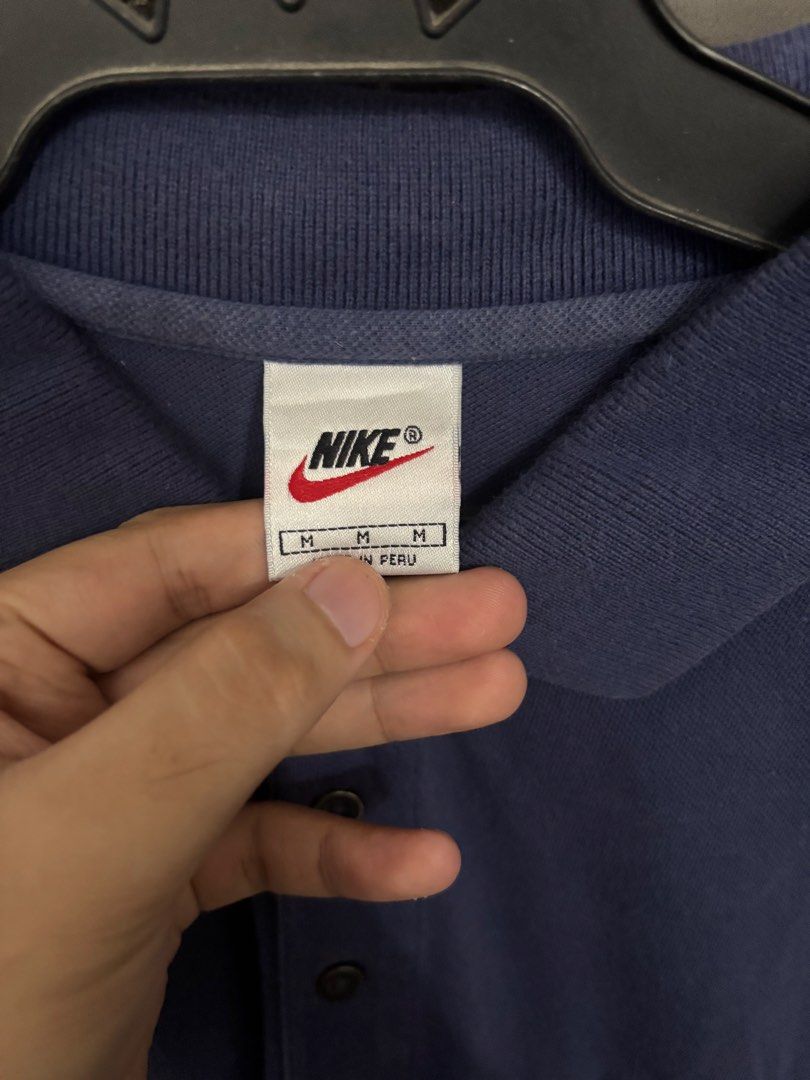 Nike Polo Shirt Men's Size M (Category: Tshirts & Polo Shirts ) located in Quezon City. Submitted by closetselects (Listing ID 1447736788, Image 2). Description: - Set of 2 Vintage Nike Polo Shirts - Size: Medium (M) - Origin: Made in Peru - Colors: Navy Blue and Reddish-Brown - Features: Classic Nike logo on chest - Ideal for: Casual wear, sporty look.
