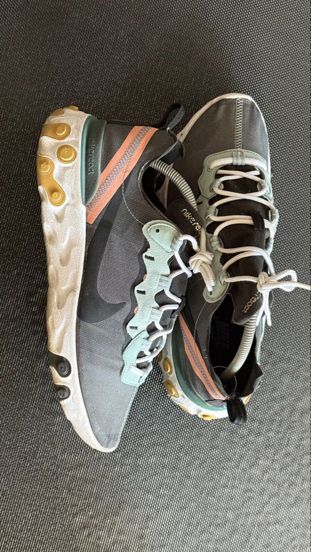 Nike React Element 87 (Category: Sneakers) located in Tarlac. Submitted by iriesoleeditph (Listing ID 1447743473, Image 1). Description: - Nike React Element 87 sneakers - Color: Grey with teal and pink accents - Features a unique translucent upper - Equipped with a chunky React sole for superior comfort - Versatile: perfect for casual wear or running - Condition: Shows some signs of wear on sole and upper, but still has plenty of life left - Fee