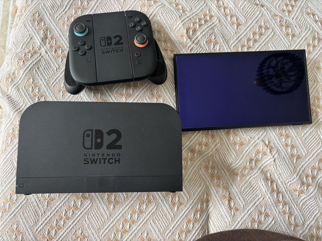 Nintendo switch 2 (Category: Nintendo) located in Kuala Lumpur. Submitted by aireen_ (Listing ID 1447818109, Image 1). Description: - Nintendo Switch Dock, Screen, and Controller Set - All items in classic black - Controller features unique blue and orange joystick accents - Ideal for replacing lost/broken parts - Perfect for setting up a second gaming station.