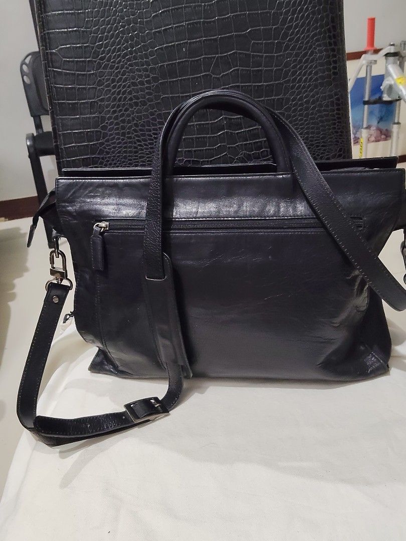 NOM ADVANCED Black Leather Top Handle Bag with Shoulder Strap (Category: Shoulder Bags) located in Cebu City. Submitted by almzcorner (Listing ID 1447706131, Image 2). Description: - Brand: NOM ADVANCED - Color: Black - Material: Genuine Leather with nice texture - Features: Top handles, detachable shoulder strap - Interior: Spacious with multiple compartments and a zippered pocket - Ideal for: Work or everyday use - Condition: Please check photo