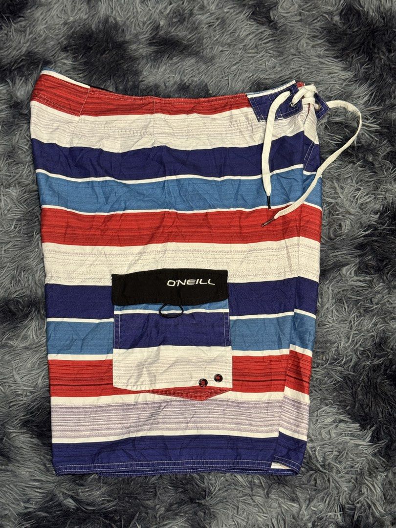 O'Neill Striped Board Shorts Size 34 (Category: Swim Trunks & Board Shorts) located in Manila. Submitted by keithanced50261 (Listing ID 1447680118, Image 2). Description: - O'Neill board shorts - Classic red, white, and blue stripe pattern - O'Neill logo detail on left leg 31x21.5 excellent condi .