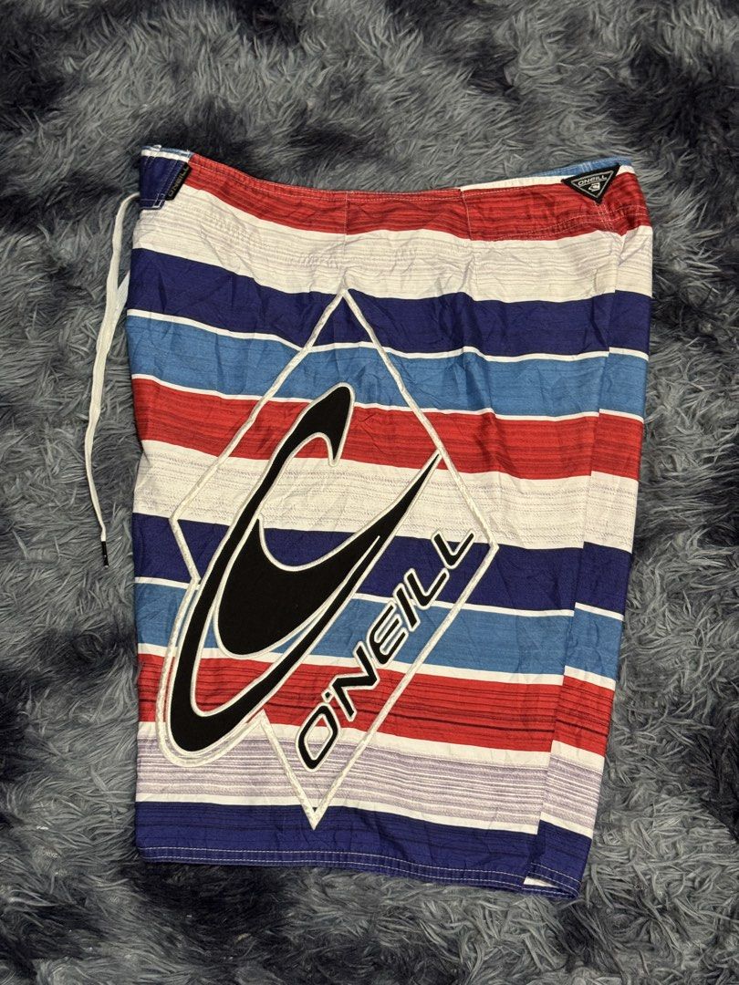 O'Neill Striped Board Shorts Size 34 (Category: Swim Trunks & Board Shorts) located in Manila. Submitted by keithanced50261 (Listing ID 1447680118, Image 1). Description: - O'Neill board shorts - Classic red, white, and blue stripe pattern - O'Neill logo detail on left leg 31x21.5 excellent condi .