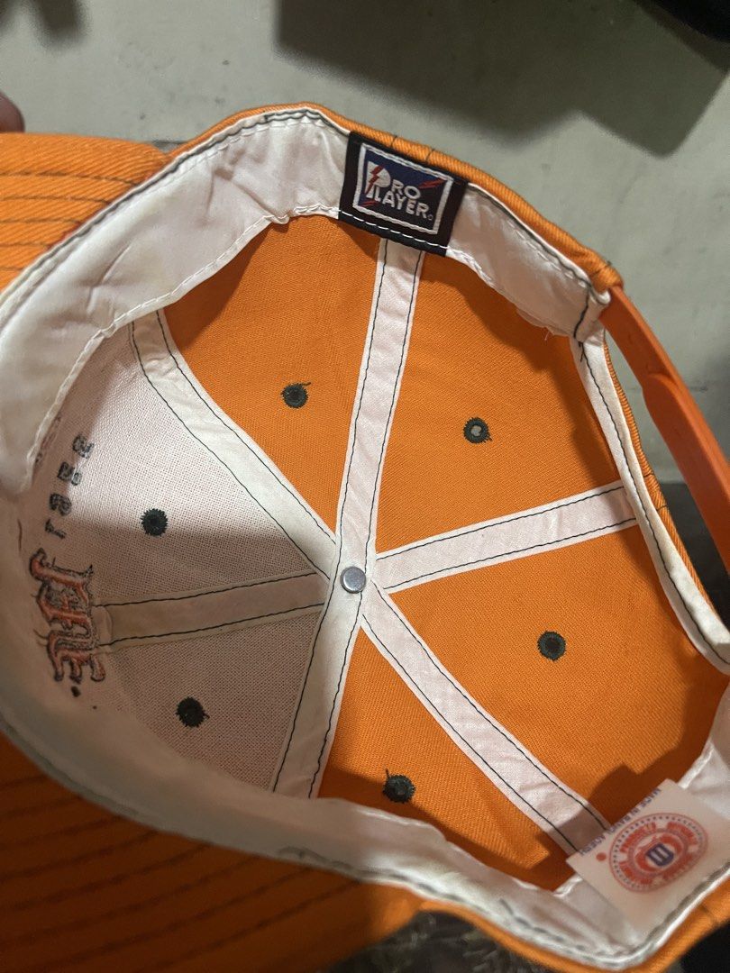 Orange Miami Est. 1925 Pro Player Snapback Cap (Category: Caps & Hats) located in Mandaluyong City. Submitted by mark2pac (Listing ID 1447842212, Image 3). Description: - Orange snapback cap - Embroidered 'Miami Est. 1925' on front - Lightning bolt 'P' logo on side - Pro Player brand tag inside - Adjustable snap closure at back - Perfect for Miami fans.