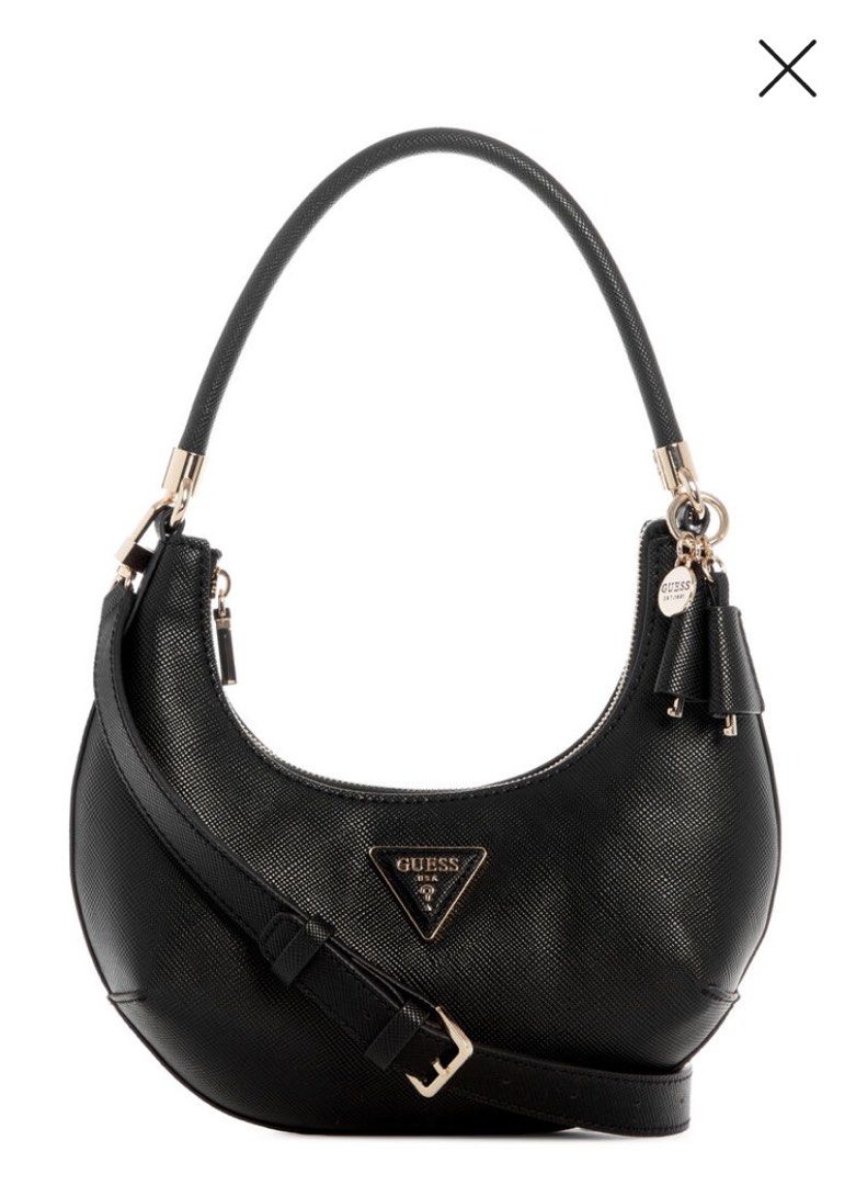 ORIGINAL Guess Black Textured Hobo Shoulder Bag (Category: Shoulder Bags) located in Mariveles. Submitted by preluvbaddie (Listing ID 1447697584, Image 1). Description: ORIGINAL BOUGHT IT AT TRINOMA GUESS FOR 9k - Black Guess hobo bag - Textured material - Gold tone hardware with tassel detail - Zipper closure - Shoulder strap and top handle - Ideal for everyday use.