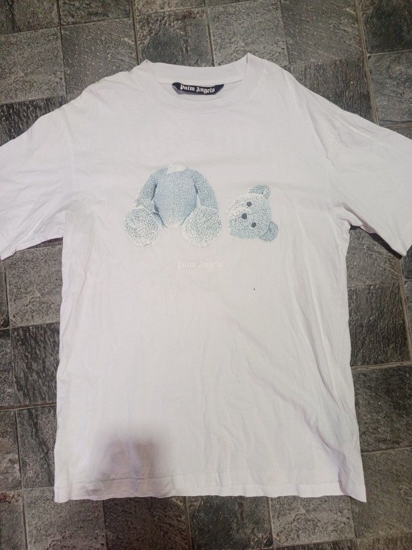 Palm Angels White Bear Print T-Shirt (Category: Tshirts & Polo Shirts ) located in Ligao. Submitted by john_thrift (Listing ID 1447720071, Image 1). Description: - Off only Palm Angels white t-shirt - Features iconic teddy bear graphic on the front - Palm Angels logo on the back - Essential for any streetwear collection 300 shipped.