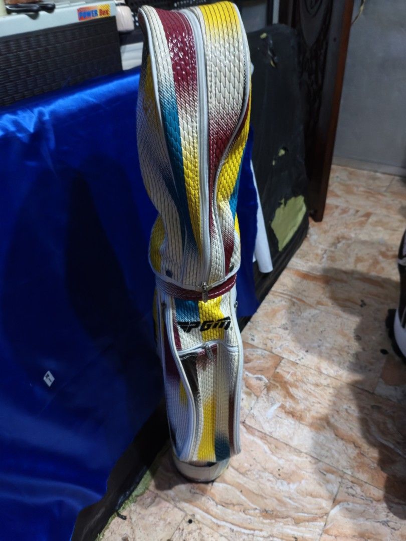 PGM Junior Golf Bag (Category: Golf) located in Manila. Submitted by meiyeon2 (Listing ID 1447882281, Image 1). Description: - Eye-catching PGM golf bag - Unique striped pattern: Red, Yellow, Blue, White - Standard size, spacious for clubs and accessories - Ideal for the golf course AsIs-pls see all pictures posted.