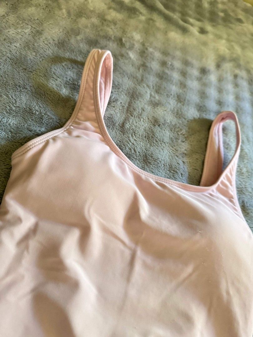 Pink One-Piece Swimsuit & Orange Bikini Set (Category: Bikinis & Swimsuits) located in Baliuag. Submitted by same1693 (Listing ID 1447681023, Image 2). Description: - Pink one-piece swimsuit - Scoop neckline - Standard straps - Orange bikini set included - Triangle bikini top - Thong bikini bottom - Both bikini pieces are adjustable with ties - Ideal for beach vacations and pool days.
