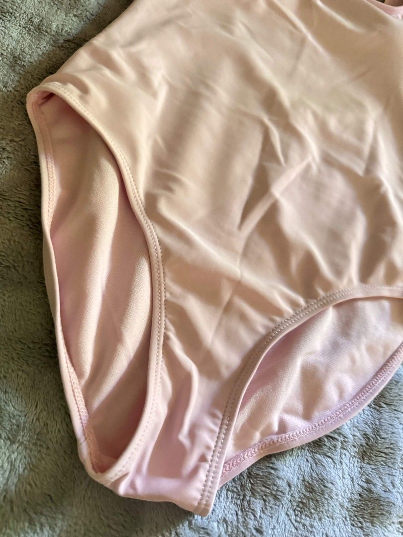 Pink One-Piece Swimsuit & Orange Bikini Set (Category: Bikinis & Swimsuits) located in Baliuag. Submitted by same1693 (Listing ID 1447681023, Image 3). Description: - Pink one-piece swimsuit - Scoop neckline - Standard straps - Orange bikini set included - Triangle bikini top - Thong bikini bottom - Both bikini pieces are adjustable with ties - Ideal for beach vacations and pool days.