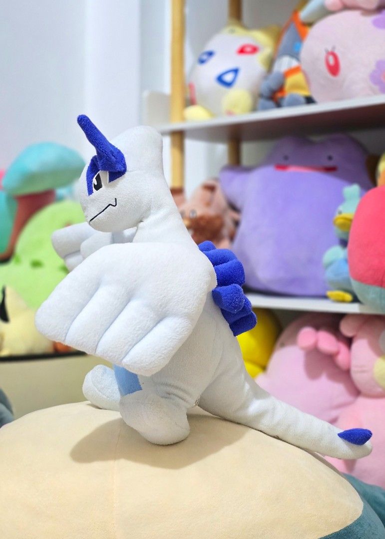 Pokemon Lugia Plush Toy (Category: Plushies & Soft Toys) located in Paranaque City. Submitted by vanchris84 (Listing ID 1447829511, Image 1). Description: - White and blue Lugia plush - Wings spread wide - Soft and huggable - Ideal for any Pokemon fan - Perfect for display or play.