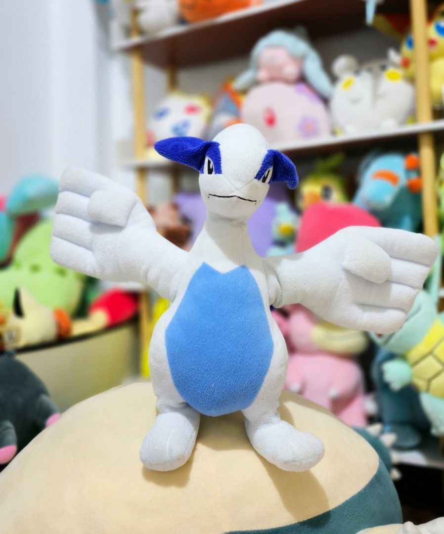 Pokemon Lugia Plush Toy (Category: Plushies & Soft Toys) located in Paranaque City. Submitted by vanchris84 (Listing ID 1447829511, Image 2). Description: - White and blue Lugia plush - Wings spread wide - Soft and huggable - Ideal for any Pokemon fan - Perfect for display or play.