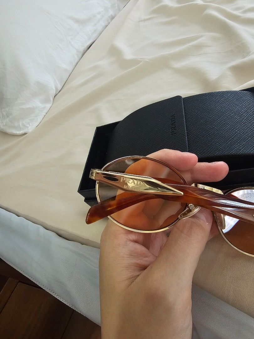 Prada gold orange PR65zS 7312 (Category: Sunglasses & Eyewear) located in Taguig. Submitted by riello (Listing ID 1447730752, Image 3). Description: can pass as new slightly negotiable. bought in Paris in Aug 2024. used only maybe 5 to 10x. decluttering .