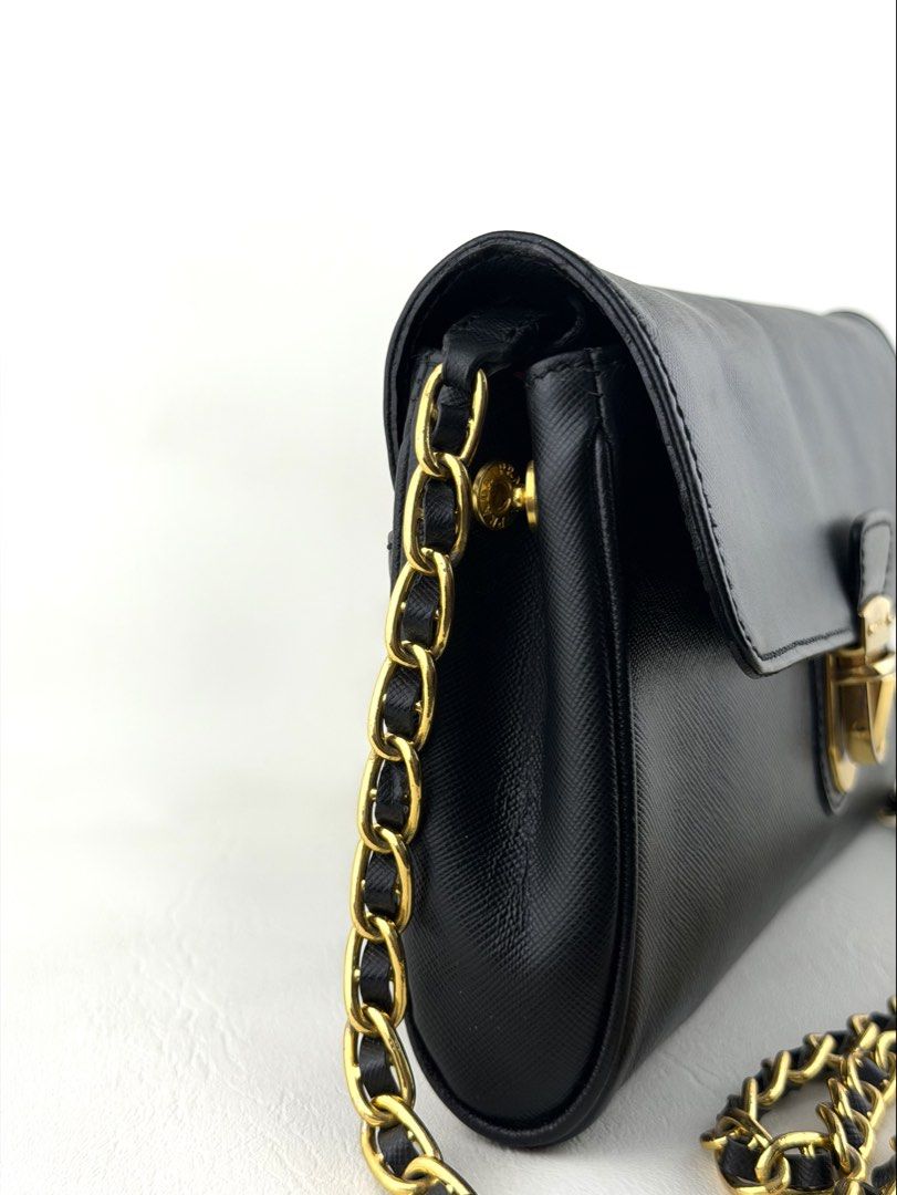 PRADA Saffiano Wallet on Chain (Category: Luxury Bags & Wallets) located in Manila. Submitted by luvluxe.mnl (Listing ID 1447819485, Image 2). Description: So elegant & chic!! Classic piece must have! With minimal sign of use— lock hardware is a bit tarnished but still presentable ☺️ No functionality issue.
