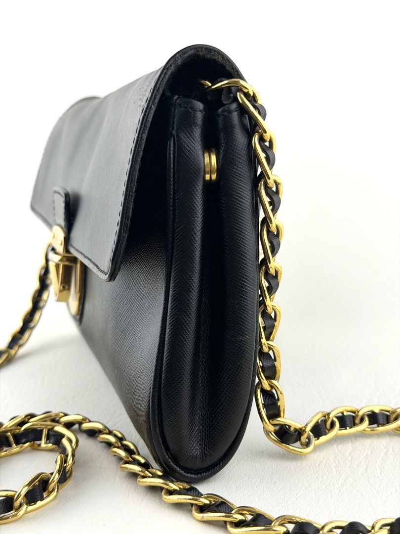 PRADA Saffiano Wallet on Chain (Category: Luxury Bags & Wallets) located in Manila. Submitted by luvluxe.mnl (Listing ID 1447819485, Image 3). Description: So elegant & chic!! Classic piece must have! With minimal sign of use— lock hardware is a bit tarnished but still presentable ☺️ No functionality issue.