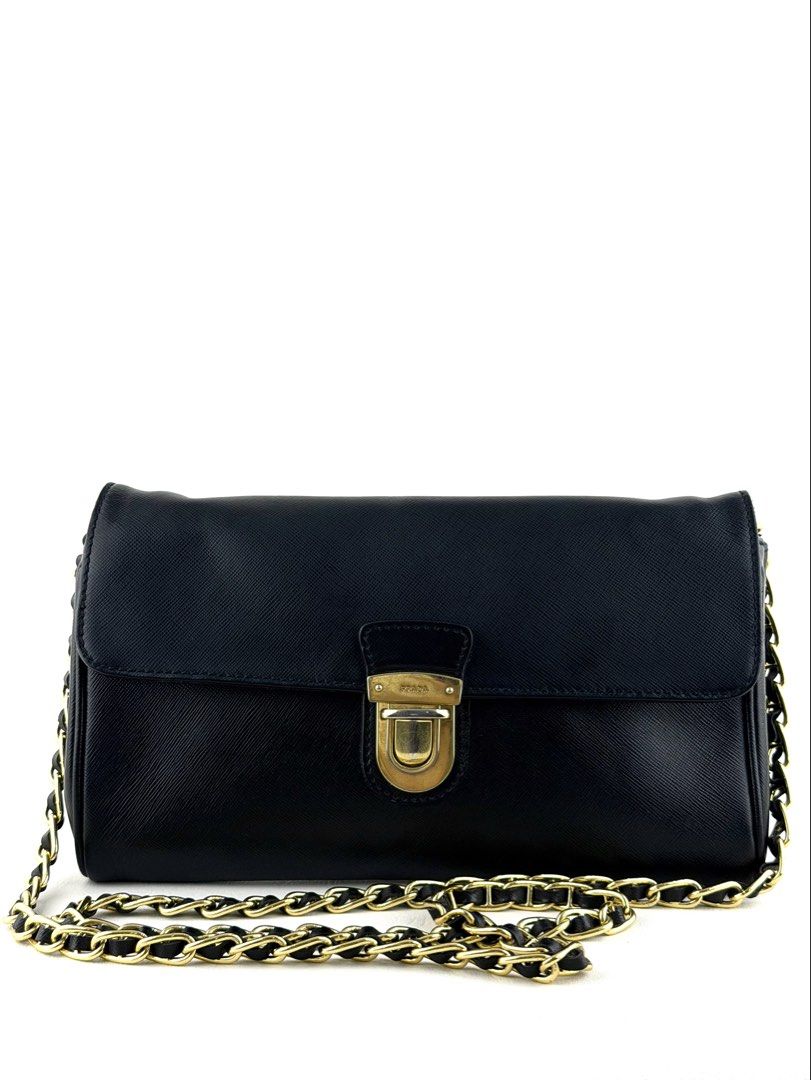 PRADA Saffiano Wallet on Chain (Category: Luxury Bags & Wallets) located in Manila. Submitted by luvluxe.mnl (Listing ID 1447819485, Image 1). Description: So elegant & chic!! Classic piece must have! With minimal sign of use— lock hardware is a bit tarnished but still presentable ☺️ No functionality issue.