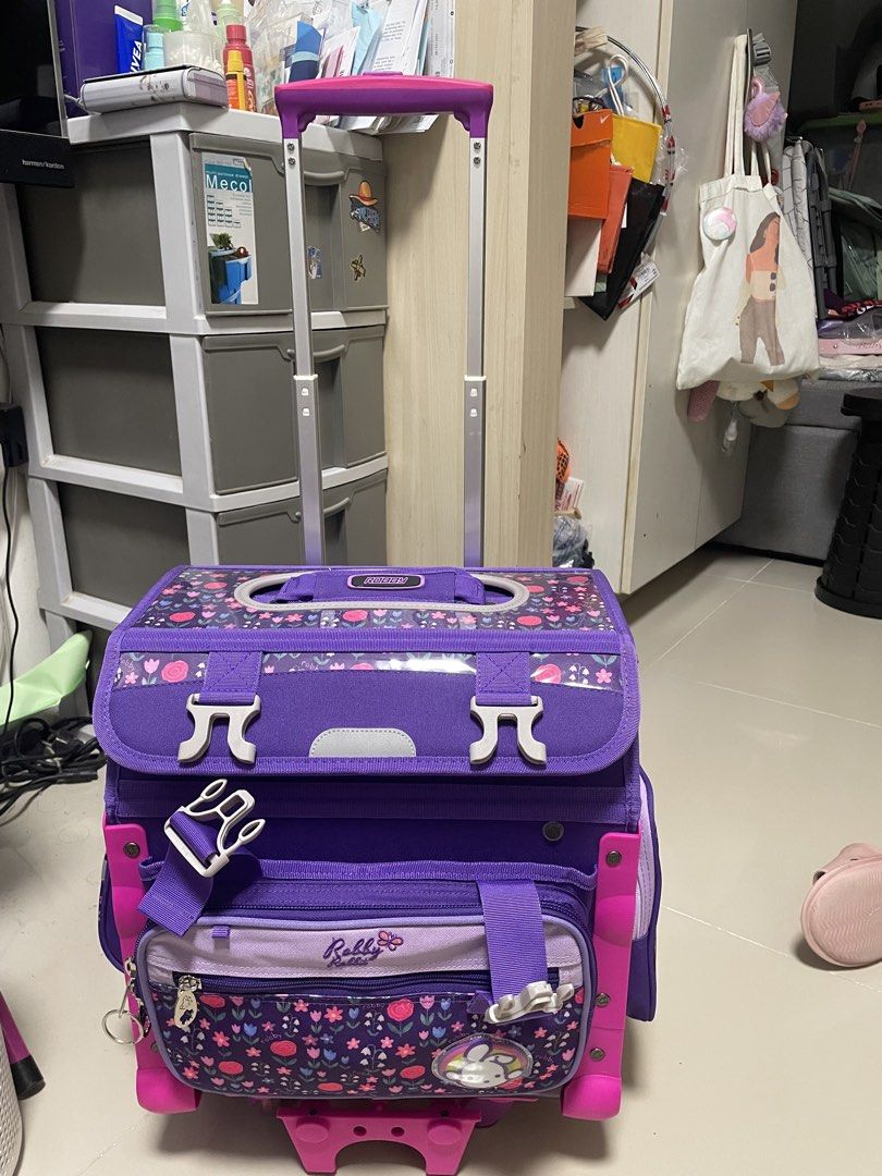 Purple Trolley Bag Robby Rabbit (Category: Everything Else Others) located in Mandaluyong City. Submitted by deizelv (Listing ID 1447874112, Image 2). Description: -Never used. My kid doesn’t want to use trolley bag anymore. -Bought for ₱4,799 - With detachable lunch bag and rain cover -Adorable purple rolling backpack for kids. - Features a cute rabbit and strawberry design. - Equipped with wheels and a retractable handle for effortless transpor