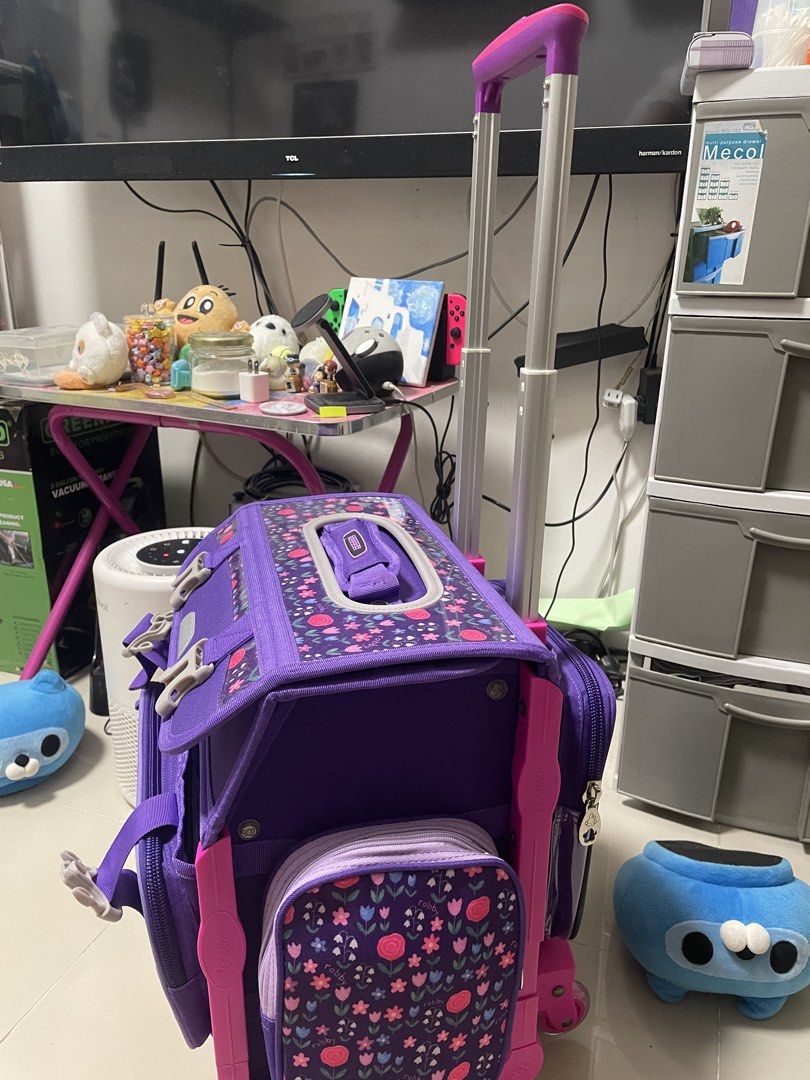 Purple Trolley Bag Robby Rabbit (Category: Everything Else Others) located in Mandaluyong City. Submitted by deizelv (Listing ID 1447874112, Image 3). Description: -Never used. My kid doesn’t want to use trolley bag anymore. -Bought for ₱4,799 - With detachable lunch bag and rain cover -Adorable purple rolling backpack for kids. - Features a cute rabbit and strawberry design. - Equipped with wheels and a retractable handle for effortless transpor
