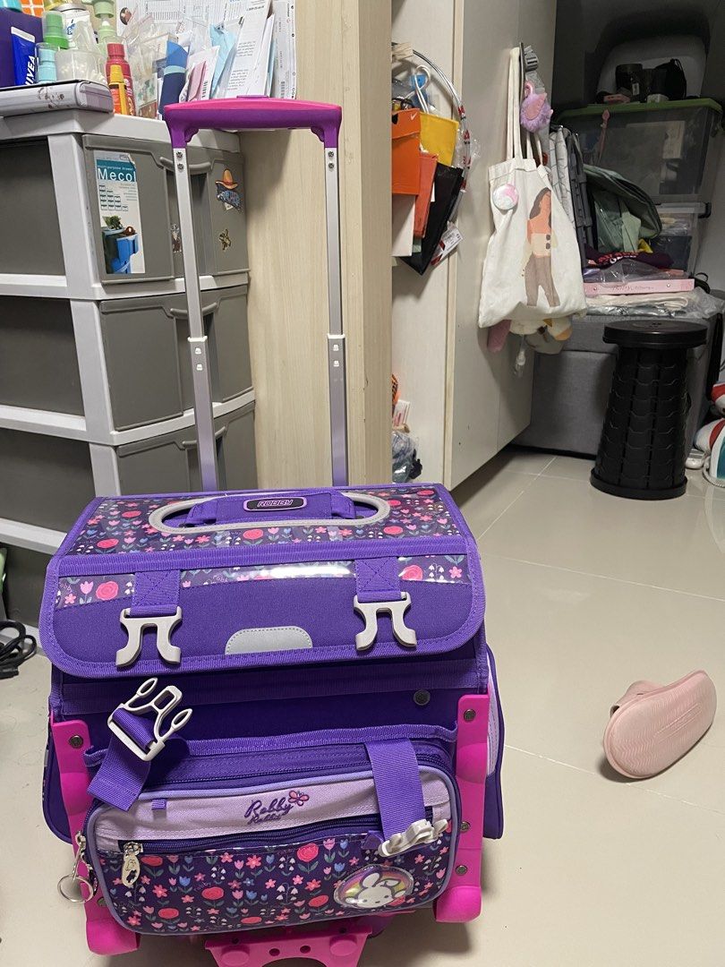 Purple Trolley Bag Robby Rabbit (Category: Everything Else Others) located in Mandaluyong City. Submitted by deizelv (Listing ID 1447874112, Image 1). Description: -Never used. My kid doesn’t want to use trolley bag anymore. -Bought for ₱4,799 - With detachable lunch bag and rain cover -Adorable purple rolling backpack for kids. - Features a cute rabbit and strawberry design. - Equipped with wheels and a retractable handle for effortless transpor