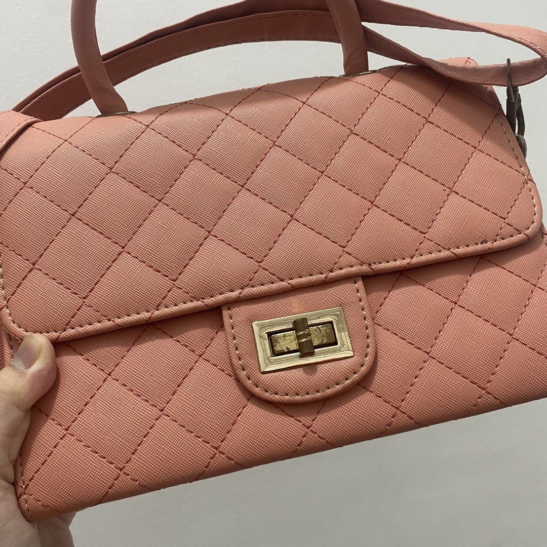 Quilted Pink Handbag with Shoulder Strap (Category: Shoulder Bags) located in Caloocan City. Submitted by _syddd (Listing ID 1447700985, Image 2). Description: - Stylish pink quilted handbag - Features a comfortable top handle - Includes a detachable shoulder strap for versatility - Secure turn-lock closure on the front flap - Interior zip pocket for essentials - Interior slip pocket for quick access - Ideal for everyday use or evening outings.