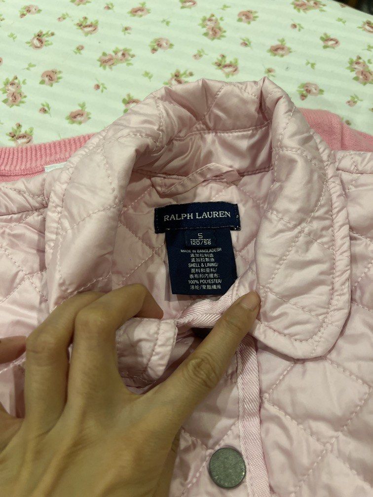 Ralph Lauren Pink Quilted Jacket (Category: Babies & Kids Fashion) located in Makati City. Submitted by declutterx (Listing ID 1447803631, Image 2). Description: - Pink quilted jacket from Ralph Lauren - Collared neckline with button-up front - Two functional front pockets - Ideal for layering - Size S (130/56) - Shell and lining: 100% Polyester.
