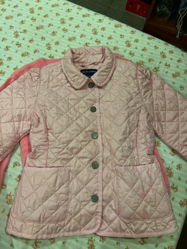 Ralph Lauren Pink Quilted Jacket (Category: Babies & Kids Fashion) located in Makati City. Submitted by declutterx (Listing ID 1447803631, Image 3). Description: - Pink quilted jacket from Ralph Lauren - Collared neckline with button-up front - Two functional front pockets - Ideal for layering - Size S (130/56) - Shell and lining: 100% Polyester.