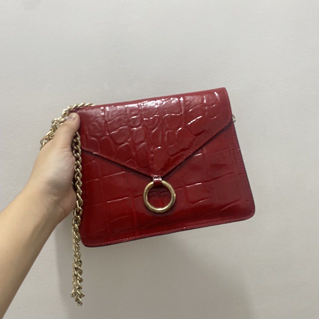 Red Croc Embossed Chain Shoulder Bag (Category: Shoulder Bags) located in Caloocan City. Submitted by _syddd (Listing ID 1447744247, Image 1). Description: - Eye-catching red shoulder bag - Luxurious croc-embossed texture - Elegant gold chain strap - Stylish ring detail on the front flap - Convenient interior zipped pocket - Proudly made in Korea - Fits a small wallet, ideal for essentials.