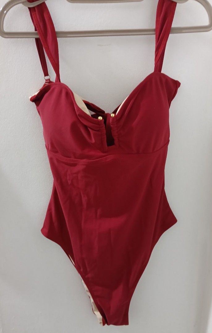 Red One-Piece Swimsuit with Tie Back (Category: Bikinis & Swimsuits) located in Quezon City. Submitted by annermt (Listing ID 1447798431, Image 1). Description: - Deep red one-piece swimsuit - Adjustable straps for a perfect fit - Secure tie-back closure - Two elegant gold-toned buttons on the front - Light beige lining - Ideal for beach and pool days rfs: sized down.
