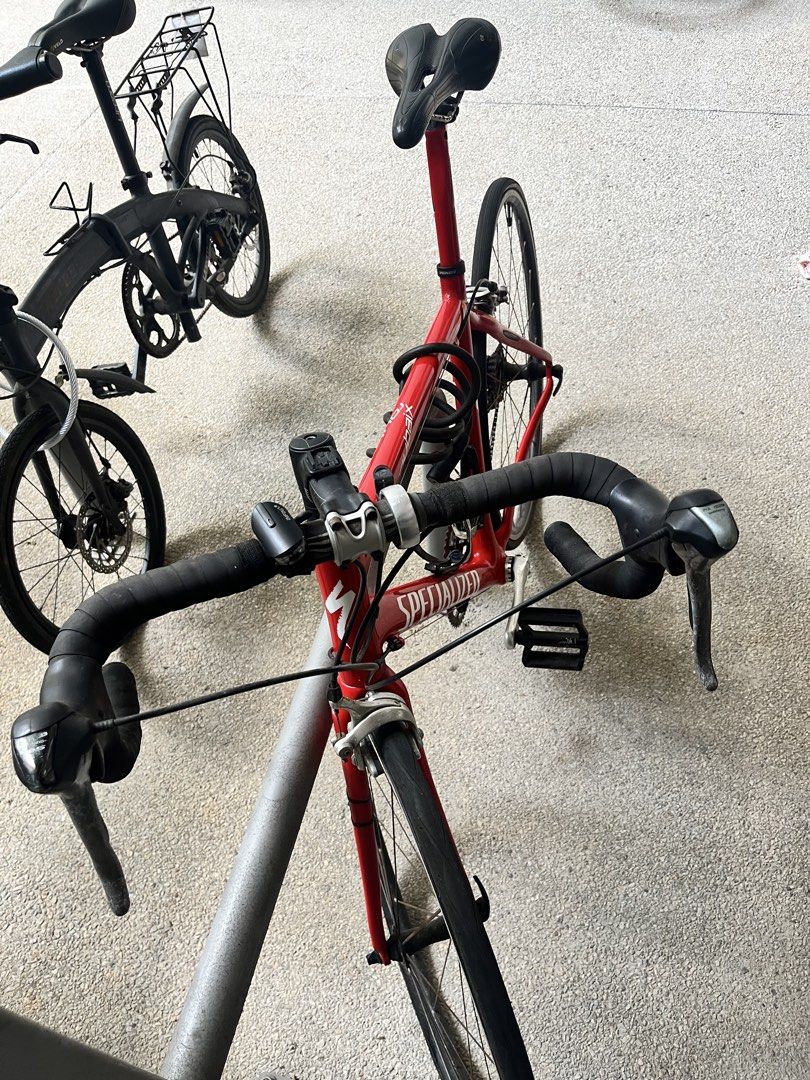 Red Specialized Roubaix Road Bike with Accessories (Category: Bicycles) located in Singapore. Submitted by arghyasad93489 (Listing ID 1447720909, Image 2). Description: Selling my Specialized Roubaix road bike as I’m relocating to Germany. I bought the bike second-hand about 2 years ago, had it serviced after purchase, and have only ridden it a handful of times since. It has been kept indoors and remains in good mechanical condition, riding and s