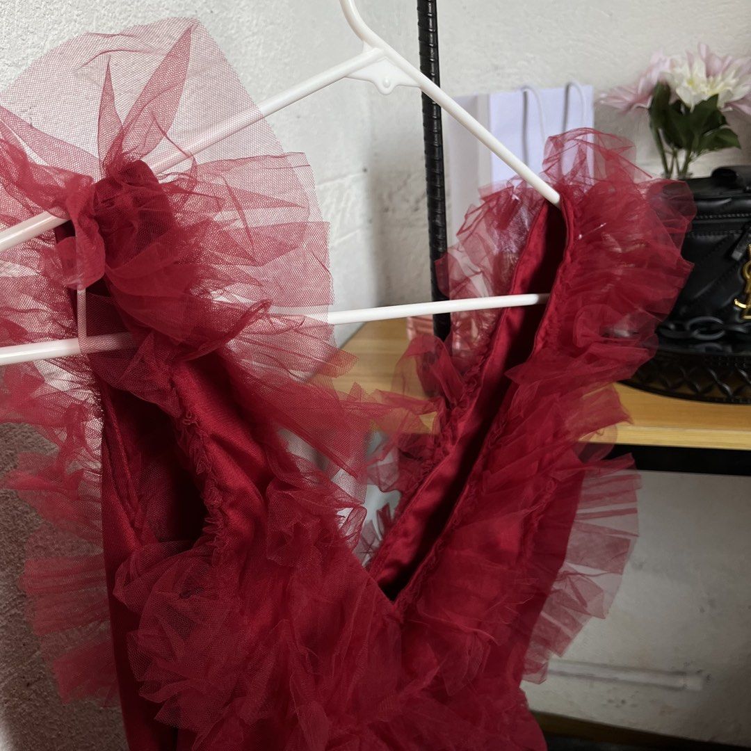 Red Tulle Ruffle V-Neck Mini Dress (Category: Dresses) located in Marikina City. Submitted by adiprelovedd (Listing ID 1447724766, Image 2). Description: - Adorable red mini dress - Features a flattering deep V-neckline - Fun and flirty tiered ruffle skirt - Likely has a smooth satin lining underneath the tulle - Ideal for parties, special occasions, or a night out - A real statement piece to turn heads!.