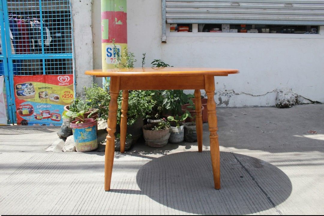 Round Dining Table (Category: Tables & Sets) located in Meycauayan. Submitted by marygracecasimiro (Listing ID 1447879885, Image 2). Description: Solid Wood Round Dining Table Classic round solid wood dining table with a smooth polished top and traditional turned wooden legs. Finished in a warm honey-amber tone that highlights the natural wood grain, it offers a timeless rustic look. Sturdy and elegant L:40 ¼ • W:40 ¼ • H:28 inches 8,800 pesos on