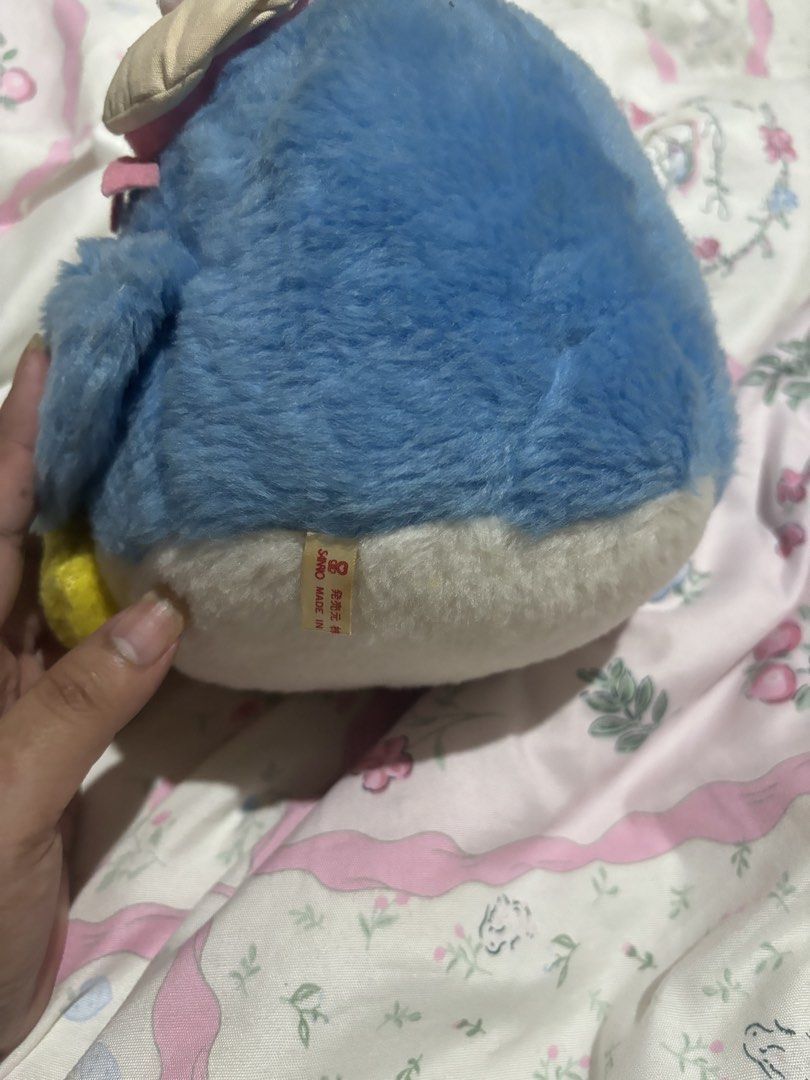 Sanrio Tuxedo Sam Penguin Plush Toy (Category: Plushies & Soft Toys) located in Manila. Submitted by meloopsy (Listing ID 1447809075, Image 2). Description: - Adorable blue penguin plush toy - Features a sweet pink bow and a charming little hat - Bright yellow feet and beak add a pop of color - Authentic Sanrio item, Made in Japan - Ideal for Sanrio enthusiasts and collectors - Makes a delightful decorative piece.