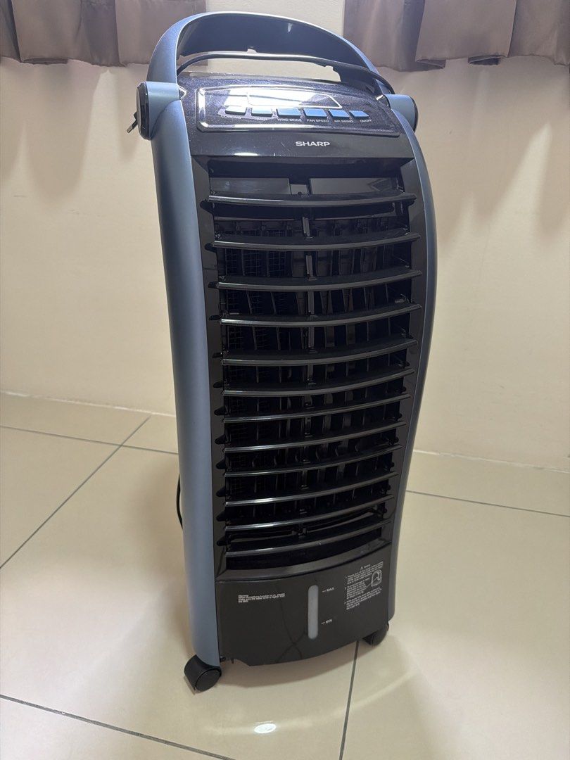 Sharp Air Cooler with Water Tank and Wheels (Category: Air Conditioners & Heating) located in Kuala Lumpur. Submitted by zealfire_987743 (Listing ID 1447680596, Image 1). Description: - Brand: Sharp - Type: Air Cooler - Features: Water tank at the bottom, wheels for easy mobility, top control panel - Function: Effectively cools down rooms - Condition: Works well Price can nego.