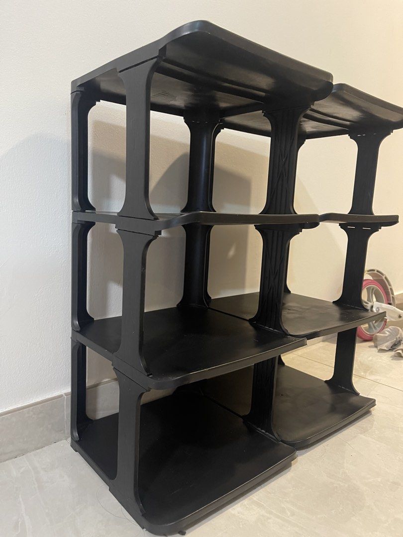 Shoe rack - stackable (Category: Shelves, Cabinets & Racks) located in Singapore. Submitted by k9823 (Listing ID 1447814525, Image 1). Description: - Set of 2 black 3-tier shelving units - Modular: can be stacked or used side-by-side - Ideal for organizing shoes, books, and more - Made of sturdy plastic - Easy to assemble and disassemble - Pickup only.