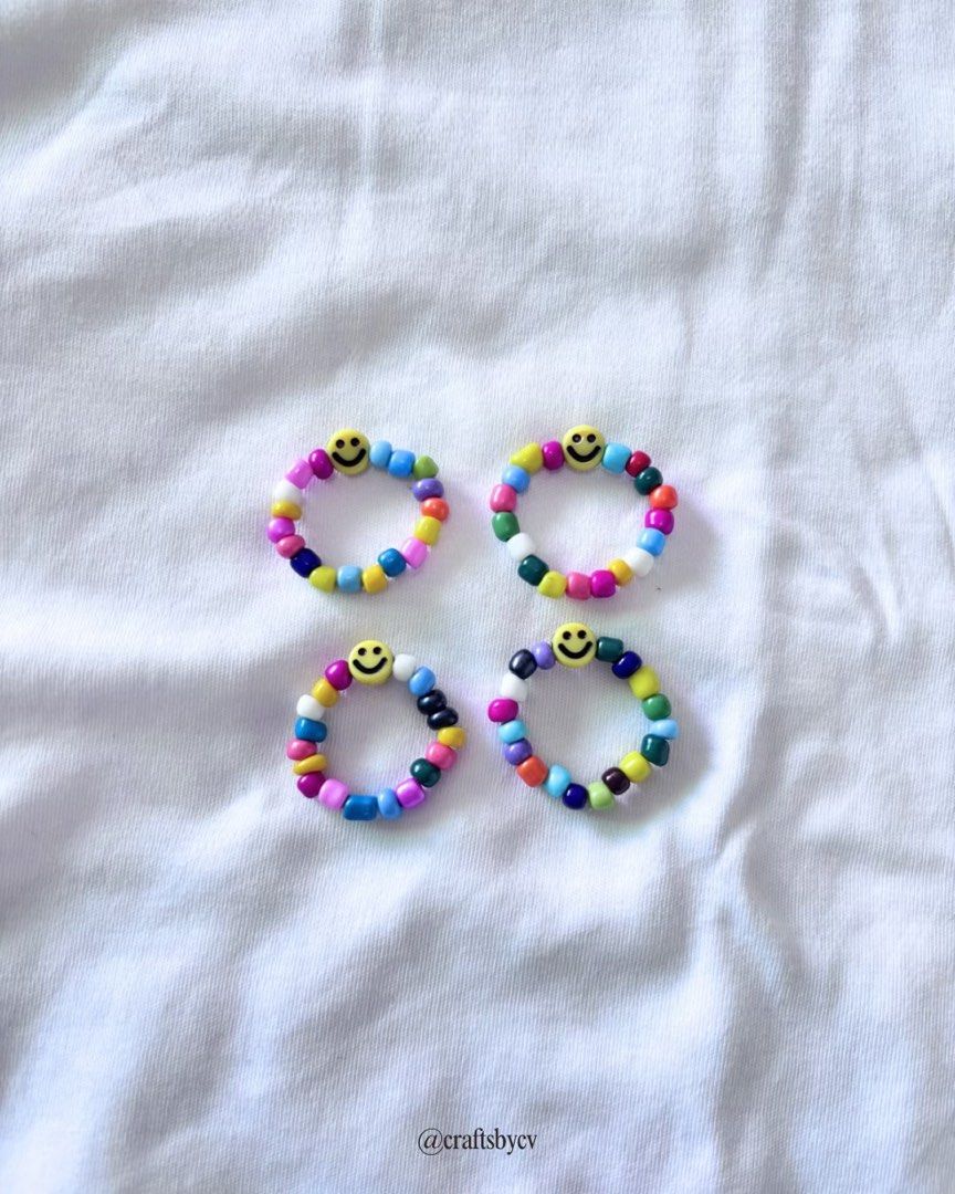 Smiley Face Beaded Bracelets and Rings (Category: Body Jewelry) located in Pasig City. Submitted by issa_declutter (Listing ID 1447697028, Image 3). Description: - Handmade smiley face beaded bracelets and rings - Available in a variety of bright, colorful beads - Perfect for adding a fun pop of color to any outfit - Mix and match to create your own unique style - Great for gifting or treating yourself - Bracelet: PHP 20 - Ring: PHP 10 - Set (Bra