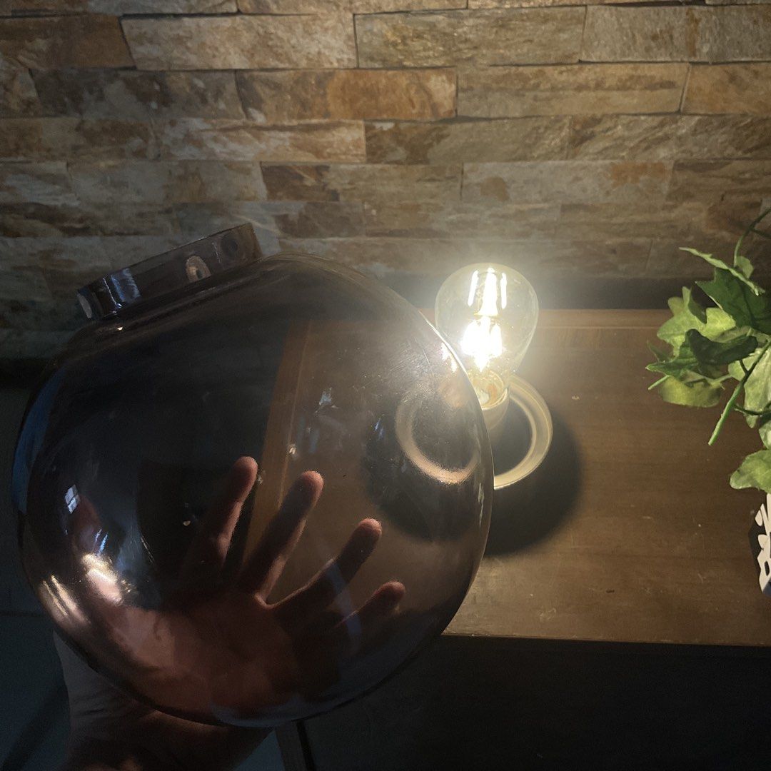 Smoke Globe Table Lamp with Edison Bulb (Category: Lighting) located in Marilao. Submitted by thewoodstudio (Listing ID 1447720681, Image 2). Description: Glass globe lamp with brushed metal base. Comes with an Edison-style bulb. *The black tinted coating is started peeling off. .