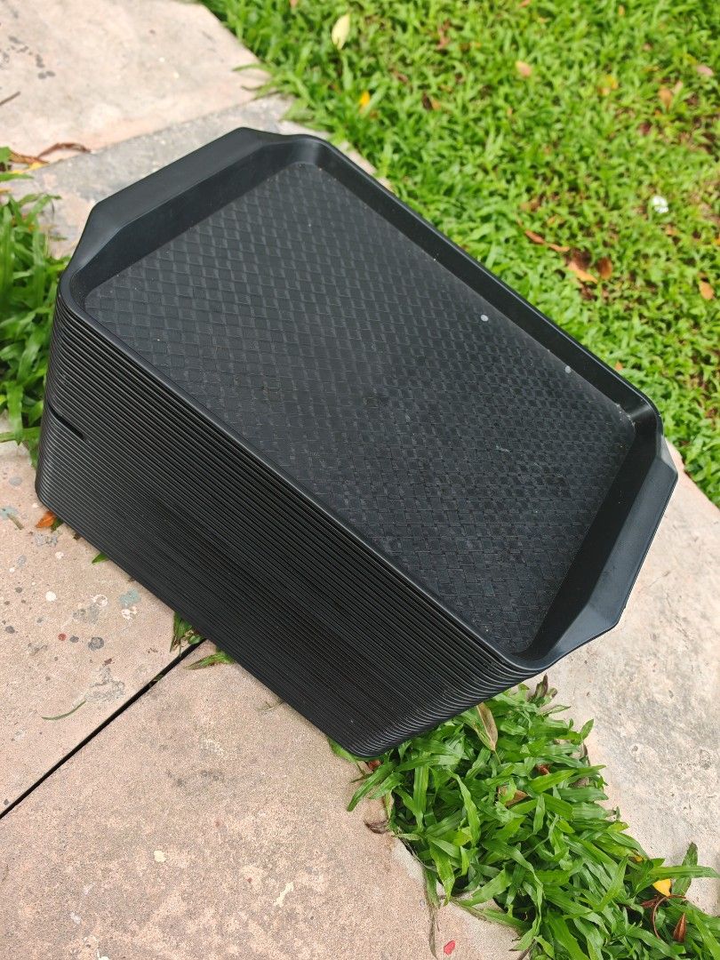 Stackable Black Serving Trays (Category: Storage Boxes & Baskets) located in Singapore. Submitted by dean9172 (Listing ID 1447749372, Image 1). Description: - Set of black serving trays - Textured surface for enhanced grip - Ideal for parties, events, and cafe use - Stackable design for easy storage - Made from durable plastic material.