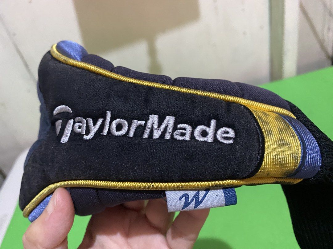 TaylorMade R5 Golf Driver Headcover (Category: Golf) located in Manila. Submitted by resi.diaz (Listing ID 1447729523, Image 3). Description: - Protect your TaylorMade R5 driver with this stylish headcover. - Features a classic black design with eye-catching yellow and blue accents. - Includes a stretchy black sock for a snug and secure fit. - Ideal for any TaylorMade enthusiast looking to keep their club safe..