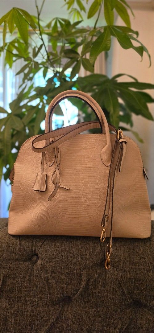 Genuine Leather Handbag with Long Sling (Alma type) (Category: Luxury Bags & Wallets) located in Manila. Submitted by amc88 (Listing ID 1447679023, Image 1). Description: - Elegant beige textured handbag - Structured base with protective gold feet - Secure top zipper closure - Stylish lock and key detail - Two comfortable top handles with extra sling - Detachable shoulder strap with gold buckle - Clean and spacious interior - Ideal for everyday w