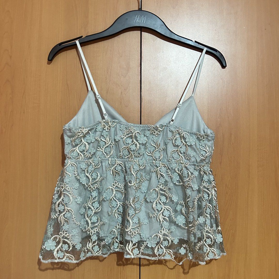 Thirty Thirty Embroidered Lace Cami Top (Category: Sleeveless) located in Mandaluyong City. Submitted by vwonu (Listing ID 1447801906, Image 2). Description: *Brand: Thirty Thirty *Size: M *Adjustable spaghetti strap * V-neck design * Floral embroidered lace overlay * Lightweight and comfortable * Great for casual wear, brunch, parties, or semi-formal occasions.