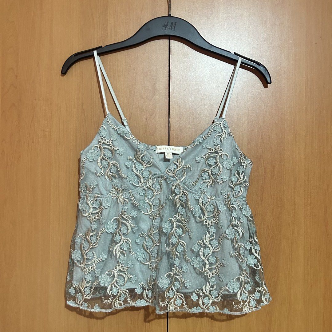 Thirty Thirty Embroidered Lace Cami Top (Category: Sleeveless) located in Mandaluyong City. Submitted by vwonu (Listing ID 1447801906, Image 1). Description: *Brand: Thirty Thirty *Size: M *Adjustable spaghetti strap * V-neck design * Floral embroidered lace overlay * Lightweight and comfortable * Great for casual wear, brunch, parties, or semi-formal occasions.