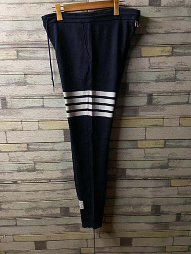 Thom Browne 4 Bar Classic Cotton Sweatpants (Category: Joggers) located in Cainta. Submitted by baddieshop.mnl (Listing ID 1447867508, Image 1). Description: Excellent condition No issues Authentic Thom Browne Made in Japan Complete Tags with code Size: 3 - Large Dimension: W: 32 - 42 L:41 .