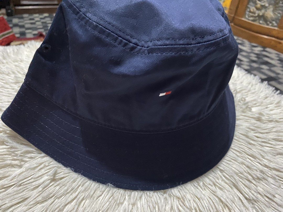 Tommy Hilfiger Navy Blue Bucket Hat OS (Category: Caps & Hats) located in Bulacan. Submitted by rich2545 (Listing ID 1447787922, Image 2). Description: - Navy blue Tommy Hilfiger bucket hat - Size: OS (One Size Fits Most) - Classic and simple design - Ideal for sunny days - Easy to pack and travel-friendly - Perfect for completing casual outfits.