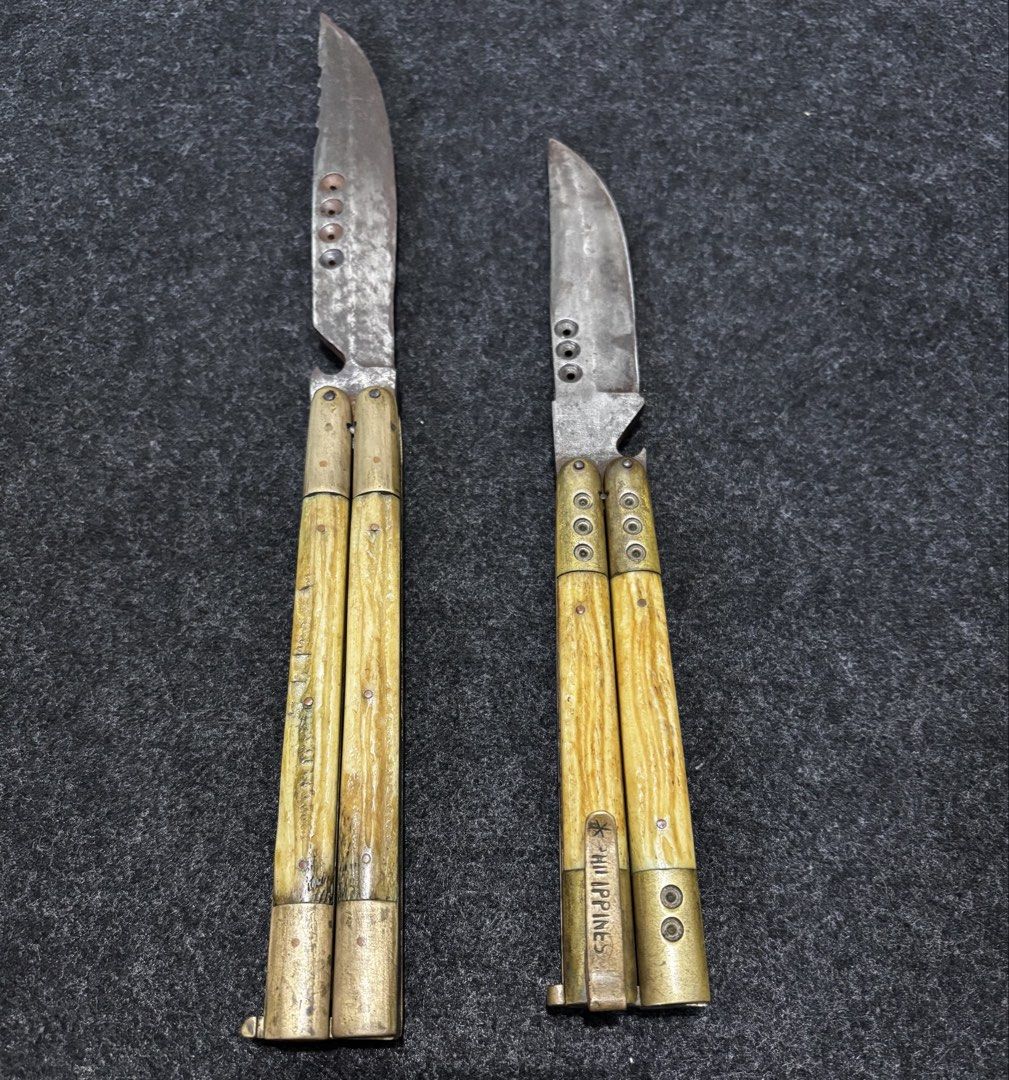 Vintage Butterfly Knives Philippines Bone Handle Brass (Category: Vintage Collectibles) located in Bacoor. Submitted by round2pinas (Listing ID 1447873872, Image 2). Description: - Two vintage butterfly knives - One etched with 'PHILIPPINES' on brass - Handles appear to be bone or horn - Brass bolsters and pins - Unique collectible items - Ideal for display or practice.