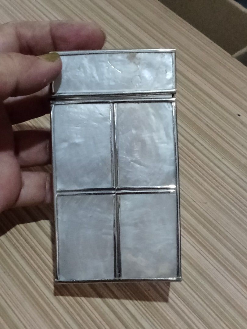 Vintage Capiz Cigarette Case Holder (Category: Vintage Collectibles) located in Bocaue. Submitted by marajapansurplus (Listing ID 1447725698, Image 1). Description: - Vintage capiz cigarette case - Silver-toned metal frame - Lid opens and closes smoothly - Measures approx. 3.5 inches x 3 inches - Perfect for protecting cigarettes or as a small trinket box - Nice decorative piece.